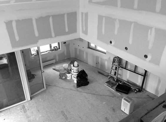 Overlooking the living and dining rooms from the open, second floor landing